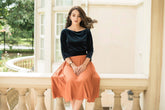 Pleated midi skirt in soft velvet fabric with flowy silhouette and structured waistband